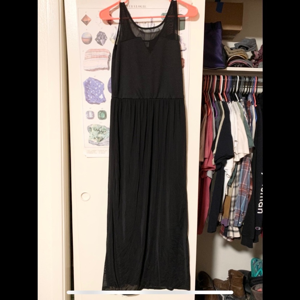 Long black dress. Semi-sheer outer layer